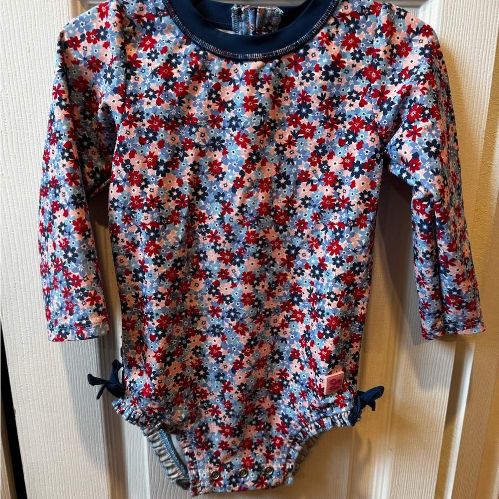 Gently used Ruffle Butts Floral Long Sleeve Swimsuit in 2t for girls .